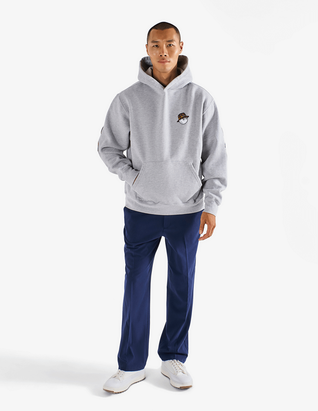 Full body shot of model wearing of Bushmills x Malbon gray hoodie.
