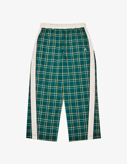 Front of Bushmills X Malbon Track Pants.