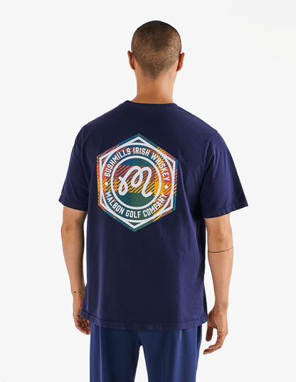 Back view of Bushmills x Malbon navy tee on a male model. 