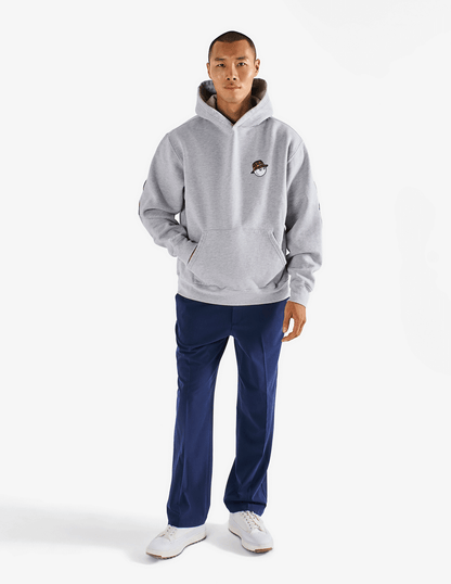 Full body shot of model wearing of Bushmills x Malbon gray hoodie.