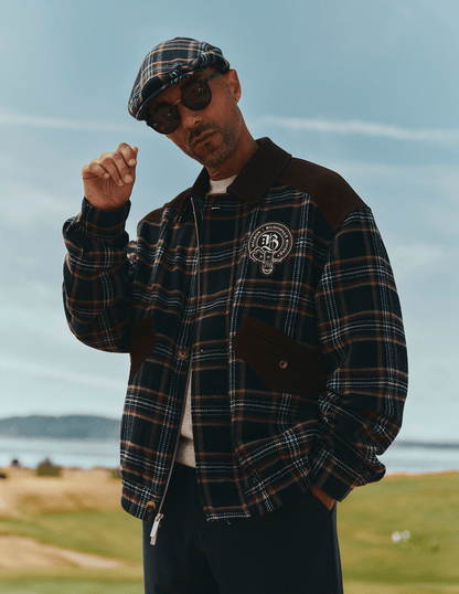 Bushmills X Malbon Wool & Leather Jacket on a model on the golf course.