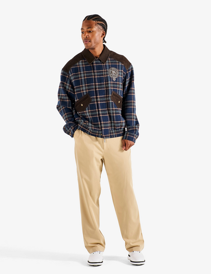 Front view of Bushmills X Malbon Wool & Leather Jacket on a model with khaki pants.