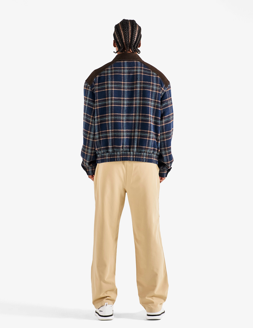 Back view of Bushmills X Malbon Wool & Leather Jacket on a model with khaki pants.